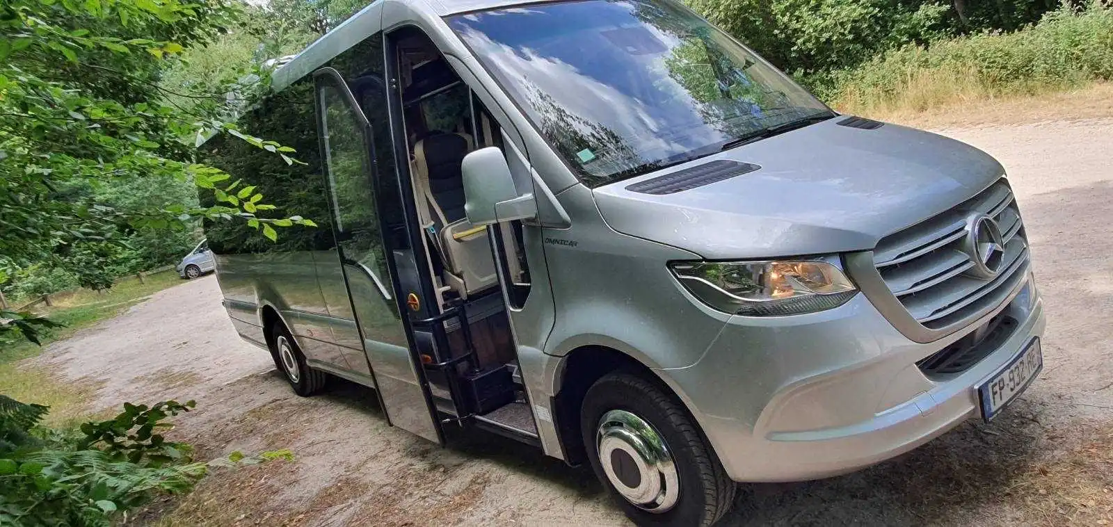Exterior of a Mercedes Sprinter bus with a sleek and modern design.