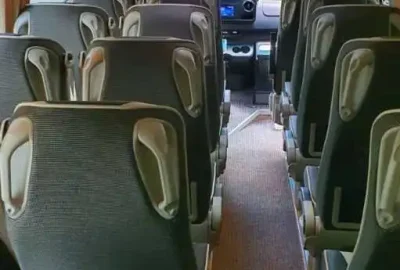 Rear view of a premium tourist bus interior, showcasing modern features and comfort.