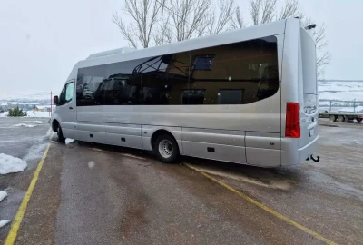 Tourist bus parked in a snowy landscape – A premium transport option for group trips.