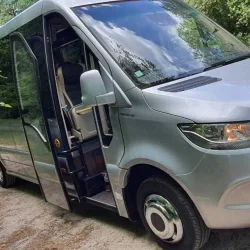 Exterior of a Mercedes Sprinter bus with a sleek and modern design.