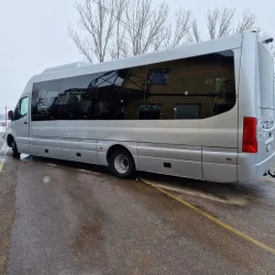 Tourist bus parked in a snowy landscape – A premium transport option for group trips.